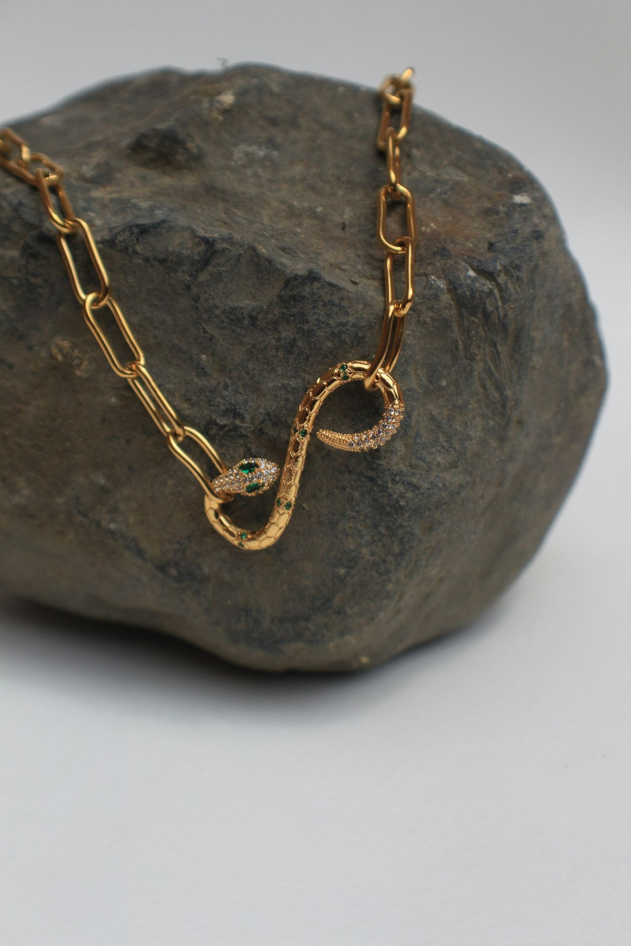 a close up of a chain on a rock